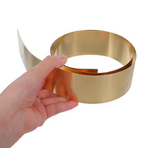 Thin Brass Sheet Roll And Brass Foil For DIY Jewelry Making And Craft Projects With High Thermal Conductivity And Wear Resistance For Mechanical Parts Decorative Projects Garden Crafts And Grounding Uses, hand holding rolled brass foil