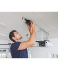 Man installing MyQ-Garage system to control your garage door from your phone anywhere open it on the go monitor it and get real time alerts