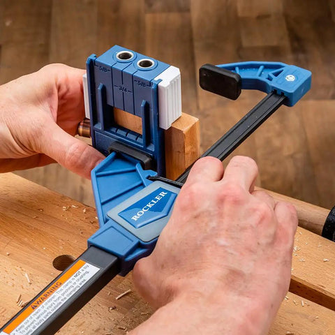 One Handed 10 Inch Bar Clamp With Spring Loaded Trigger Grip holding wood on workbench