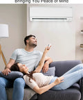 Couple relaxing under air conditioner with remote, highlighting Plug And Play Replacement Brushless DC Fan Motor For Inverter Air Conditioners