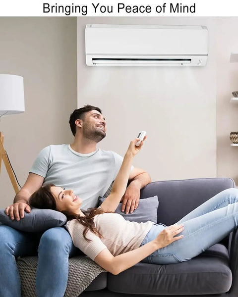 Couple relaxing under air conditioner with remote, highlighting Plug And Play Replacement Brushless DC Fan Motor For Inverter Air Conditioners