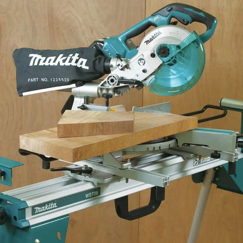 Miter saw mounted on compact folding miter saw stand with lightweight aluminum tubular frame, large wheels, side handle
