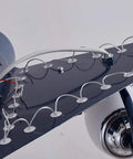 Close-up of Airplane Shape Three Light Pendant For Kids Room Metal LED Suspension Fixture showing wing details and wiring.