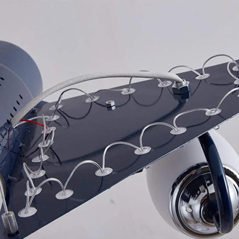 Close-up of Airplane Shape Three Light Pendant For Kids Room Metal LED Suspension Fixture showing wing details and wiring.