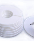 Stack of round white dividers with marker pen; Set Of 20 Closet Size Dividers For Clothing Racks With Marker Pen Included