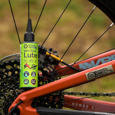 Saver Bundle Wet Bike Chain Lube And Bike Cleaner Set Natural Eco Friendly Palm Oil Free Made In UK next to bicycle wheel.