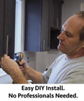 Man installing Rock Solid Stainless Steel Euro Bar Cabinet Handles Plus Drawer Pulls on kitchen cabinets with drill.
