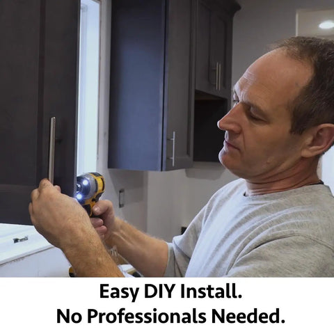 Man installing Top Shelf Solid Stainless Steel Euro Bar Cabinet Handles And Drawer Pulls Featuring Sleek Marble Finish.