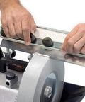 Heavy Duty Planer Jointer Blade Sharpener SVH-320 Jig Fits Any Length Blade With Zero Wobble Rig shown in use, sharpening a blade on a grinder.