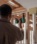Person using 18V MultiVolt Cordless Drill And Driver Kit With Brushless Motor Half Inch Keyless Metal Chuck 620 Inch Pounds Torque