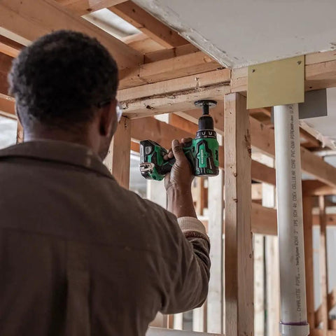 Person using 18V MultiVolt Cordless Drill And Driver Kit With Brushless Motor Half Inch Keyless Metal Chuck 620 Inch Pounds Torque