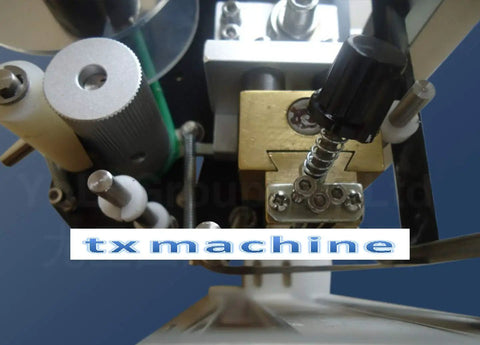 Close-up of High Speed Round Bottle Labeling Machine Plus Slick Date Printer components and adjustments.