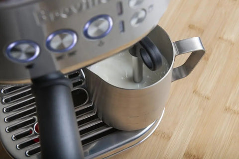 Damson Blue Kickass Espresso Coffee Maker Featuring Auto Milk Frother Quick Heat Technology and Reliable Pressure Pumping For Next Level Barista Quality Home Brews Any Day with stainless steel frothing pitcher.