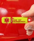 Person holding Emergency Worker Hard Hat Reflective ID Sticker Set 0.5 X 2.75 Inches Fluorescent Lime Yellow And Red