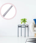 Peel And Stick White PVC Wall Wrap Slick Self Adhesive Roll For Cabinets And Bathrooms That Goes Down Smooth on display in a home setting.