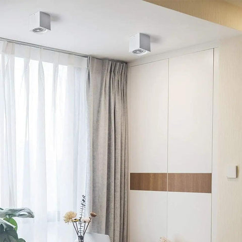 Two iumLeap Recessed Lighting Housing Trim Kits White COB Ceiling Spotlight Fixture Downlight in modern room.