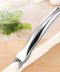 Mandoline slicer with stainless steel body and julienne blade, close-up of slicing a white vegetable.