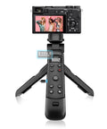 Front view of Vlogging Hand Grip Tripod With OLED Rechargeable Wireless Cam Remote, camera mounted, screen showing.