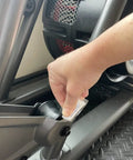 Hand applying PTFE Grease For Fitness Equipment 5 Pack Lubricant For Bearings And Joints to gym machine joint