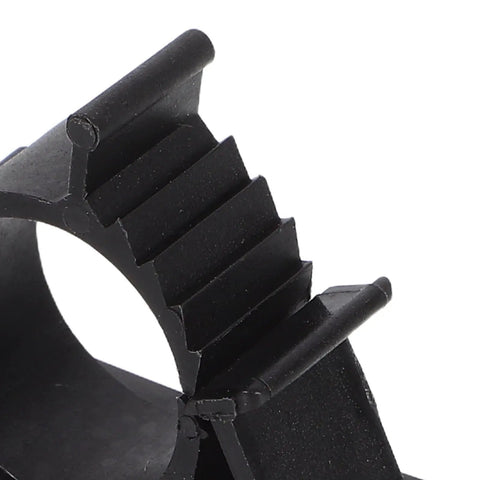Self Adhesive Pipe Holder Clamps For Filtration System Tubes And Washing Machine Hoses, Black plastic clip with cushioned lining, close-up