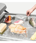 Dual Chamber Food Vacuum Sealer, Stainless Steel Double Chamber Packaging System, sealing assorted meats and veggies.