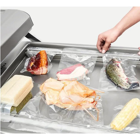 Dual Chamber Food Vacuum Sealer, Stainless Steel Double Chamber Packaging System, sealing assorted meats and veggies.