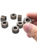 Beefy Helical Gear Set 10 Pieces 1M 14T D-Hole 8mm Metal Motor Gear with 14 Teeth shown close-up in hand