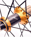 Close-up of hub on Beefy Lightweight 700C Road Bike Wheelset With Double Wall Aluminum Rims 40mm Rim Height, black and gold detail.