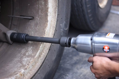 Using Built Tough CrV Steel Three Quarter Inch Drive Impact Extension Bar Set on car wheel for tight space access