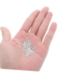 Hand holding 200 metal flat washers for eyeglasses replacement gaskets rimless glasses quick repair kit for sunglasses and eyeglass frames.