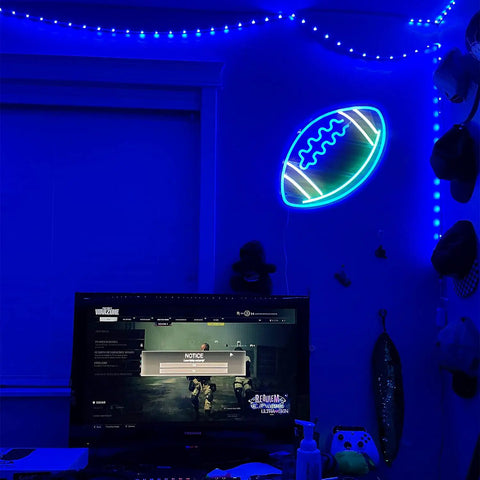 Blue Football Shape Neon Light Sign LED USB Powered Wall Decor illuminated in a game room, on acrylic backboard, 15x12 inches