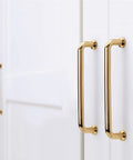 10 Pack Polished Brass Cabinet Pulls Five Inch Center To Center Spacing Five Point Six Inches Overall Length zinc alloy installed on white cabinets