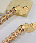 Level Up Your Cabinet Game With These Crisp 96Mm Drawer Pulls Decked Out In Glossy 24K Gold And Heavyweight K9 Crystal That Truly Bring The Hollywood Glamour Everyday - Close-up of golden drawer pulls with crystals.