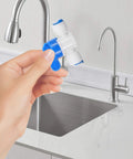 Super Easy Push To Connect White Pom Water Purifier Fittings Kit With 10 Pieces Smooth Hose Connectors No Burrs For Home Filters And Professional Use, hand holding white blue connector by sink
