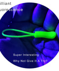 Bright Fluorescent Zipper Pulls 40 Pack Nylon Replacement Tabs for Backpacks and Bags in neon green under blacklight on hand.