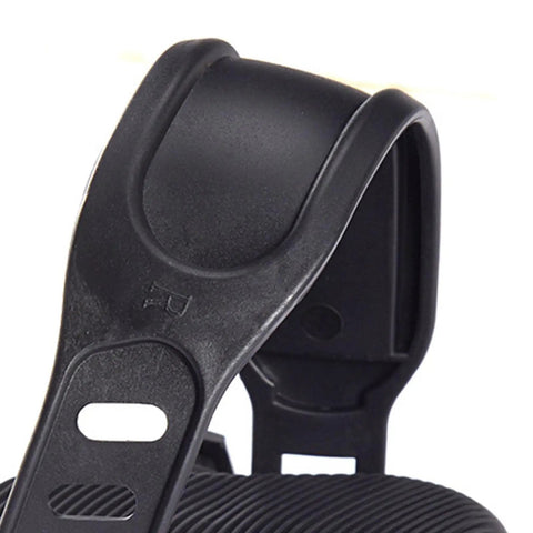 Close-up of non-slip adjustable strap on exercise bike pedal with right marking.