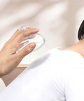 Hand using Chest Percussion Cups Mucus Removal Device With Flutter Valve on back for chest physical therapy