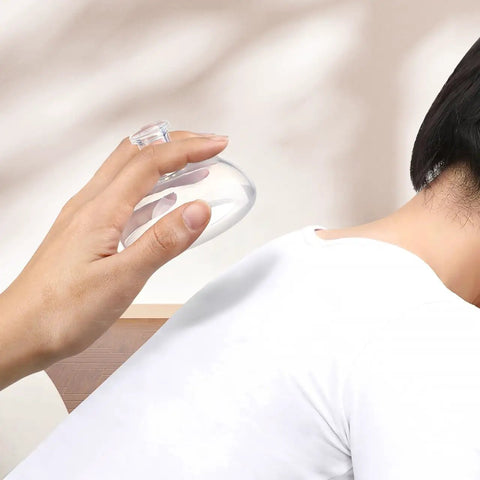 Hand using Chest Percussion Cups Mucus Removal Device With Flutter Valve on back for chest physical therapy
