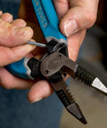 Close-up of hands using curve wire cutters for quick stripping and cutting heavy duty wire stripping tool for 8 to 18 AWG solid, made in USA
