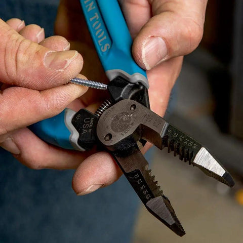 Close-up of hands using curve wire cutters for quick stripping and cutting heavy duty wire stripping tool for 8 to 18 AWG solid, made in USA