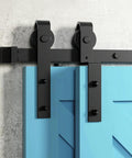 Close-up of 7Ft Bypass Sliding Barn Door Hardware Kit For Low Ceiling Spaces With Overlapping Tracks in black on a blue door