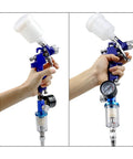 Badass Pro Hvlp Spray Gun Workhorse With Built In Regulator For Car Painting 0.8 And 1.0Mm Gravity Feed Airbrush Kit 125Ml Cup held in hand with pressure gauge.