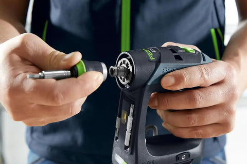 Person using Cordless CXS 2 Drill Kit With 3 Tools In One, FastFix For Centrotec Chuck, Keyless Chuck, And Optional Right Angle Attachment