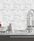 10 Sheet Peel And Stick Backsplash Tile With Faux White Marble Look In PVC Mixed Metal Finish for Kitchen And Bathroom on kitchen wall