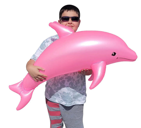 Child holding massive 40 inch pearlized dolphin inflatable pool toy for beach and poolside fun pink 3 pack centerpiece decor.