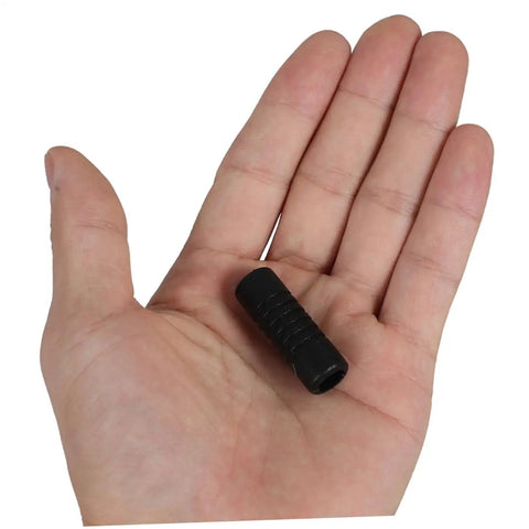 Hand holding black rubber steam wand safety guard for coffee machines