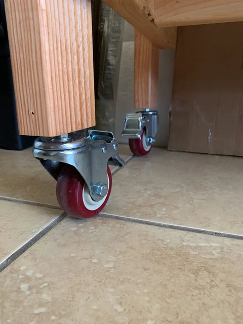 Built Like A Tank 4 Inch Swivel Caster Wheels Featuring Dual Locking Brakes, Silent Pu Polyurethane Glide On M8 Stem, Silky Smooth Furniture Casters, 4 Pack Bundle on wooden legs.