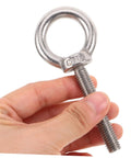 Beefy Heavy Duty M10x60 Stainless Steel Eye Bolt With Shoulder For Mounting Built To Absorb Vibration Anti Loosening Nut Ideal For Drywall Anchors And Machinery Mounts Rugged Steel Hardware, held in hand