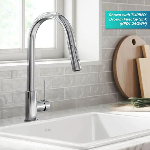 Contemporary Oletto Pull-Down Kitchen Faucet With Single Handle In Chrome Finish, displayed over a white fireclay sink