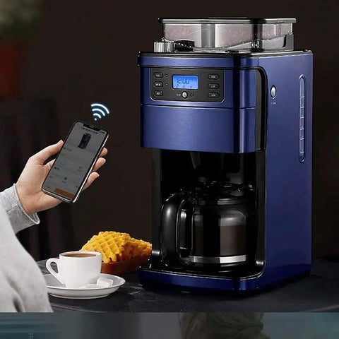 Auto Fresh Grind And Brew Coffee Machine With Built In Bean Grinder For Home Office Or Small Biz next to cup and phone